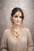 Elegant Dark Green Velvet Anarkali Suit with Gold Zardosi Work and Kundan Jewelry Featuring racdo.pk