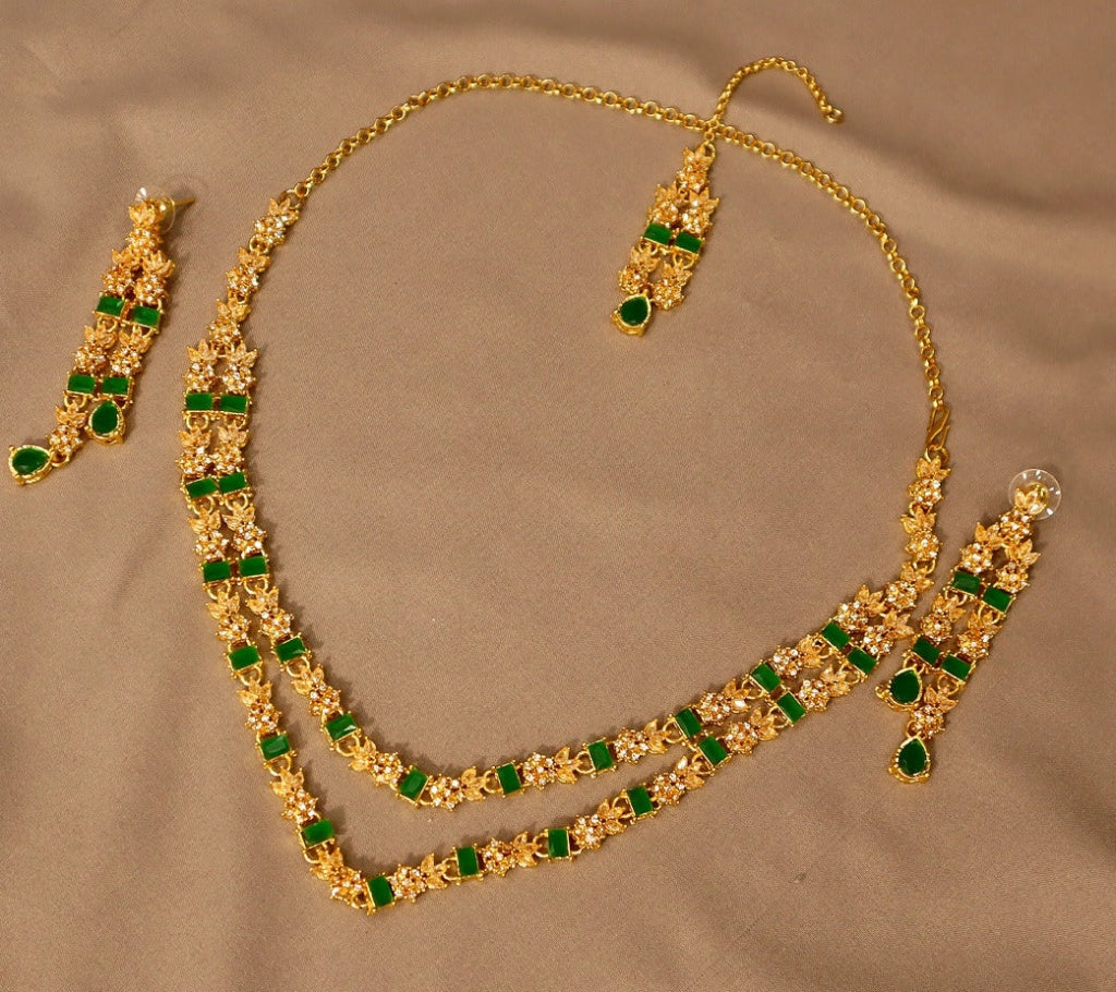 Elegant Dark Green Velvet Anarkali Suit with Gold Zardosi Work and Kundan Jewelry Featuring racdo.pk