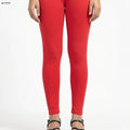Red leggings worn by a person on a white background

