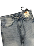 Pair of blue jeans with a tag on a white background

